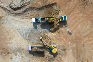 aerial-view-excavators-trucks-working-construction-site